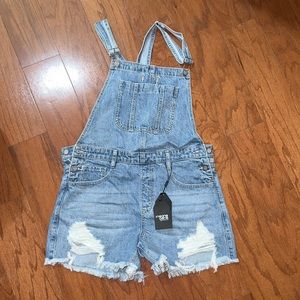 Denim overall shorts. New with tags. Size L